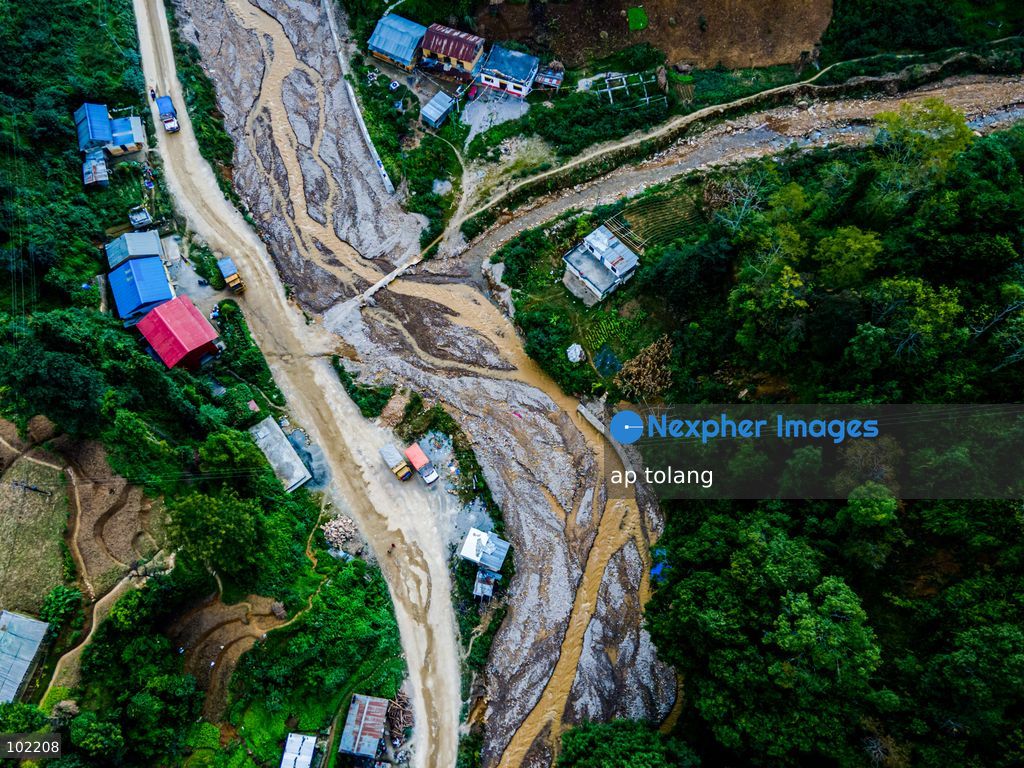 Kavrepalanchok, NEPAL, October 3, 2026: An aerial view shows changes along the banks of the Salamdo River two years after flooding in Patikharka, Kavrepalanchok, Nepal. While the landscape shows signs of recovery, the river has expanded into some areas, with flood-damaged sections of the riverbank still visible. Some areas continue to bear scars from the disaster, highlighting its lasting impact. (Photo by ap tolang/Nexpher Images)