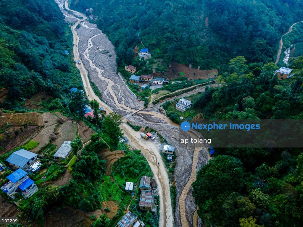 Kavrepalanchok, NEPAL, October 3, 2026: An aerial view shows changes along the banks of the Salamdo River two years after flooding in Patikharka, Kavrepalanchok, Nepal. While the landscape shows signs of recovery, the river has expanded into some areas, with flood-damaged sections of the riverbank still visible. Some areas continue to bear scars from the disaster, highlighting its lasting impact. (Photo by ap tolang/Nexpher Images)
