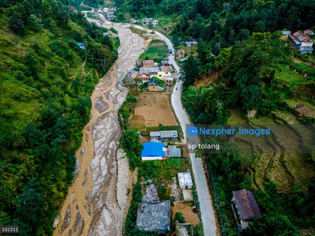 Kavrepalanchok, NEPAL, October 3, 2026: An aerial view shows changes along the banks of the Salamdo River two years after flooding in Patikharka, Kavrepalanchok, Nepal. While the landscape shows signs of recovery, the river has expanded into some areas, with flood-damaged sections of the riverbank still visible. Some areas continue to bear scars from the disaster, highlighting its lasting impact. (Photo by ap tolang/Nexpher Images)