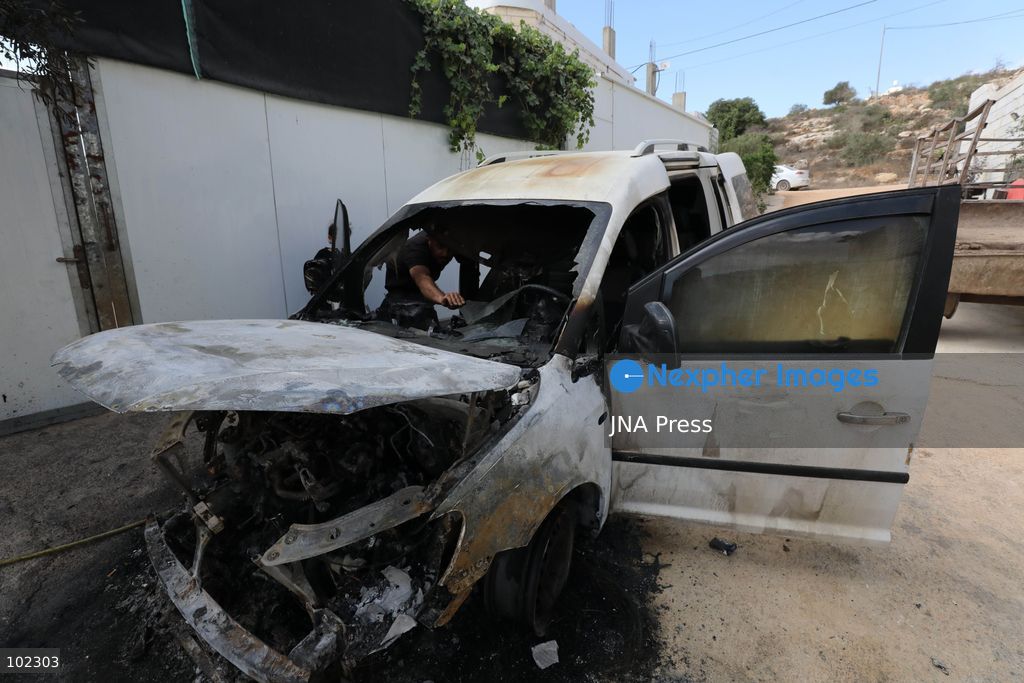 AQRABA, OCCUPIED WEST BANK, OCTOBER 6, 2026: Palestinians inspect vehicles damaged after Israeli settlers attacked the western part of Aqraba, south of Nablus, and set fire to four cars parked outside residents' homes early Tuesday. Aqraba Mayor Salah Jaber said the attackers also spray-painted slogans calling for revenge on property in the area. Photo by Nedal Shtieh / JNA Press. (Photo by Nedal Shtieh/JNA Press via Nexpher Images)