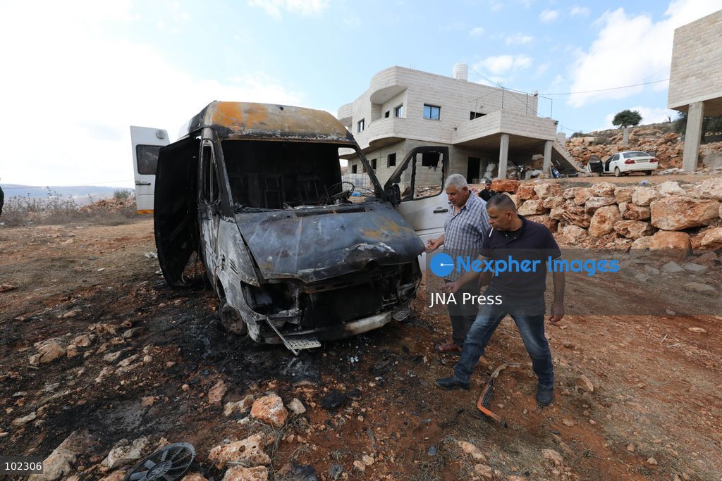 AQRABA, OCCUPIED WEST BANK, OCTOBER 6, 2026: Palestinians inspect vehicles damaged after Israeli settlers attacked the western part of Aqraba, south of Nablus, and set fire to four cars parked outside residents' homes early Tuesday. Aqraba Mayor Salah Jaber said the attackers also spray-painted slogans calling for revenge on property in the area. Photo by Nedal Shtieh / JNA Press. (Photo by Nedal Shtieh/JNA Press via Nexpher Images)
