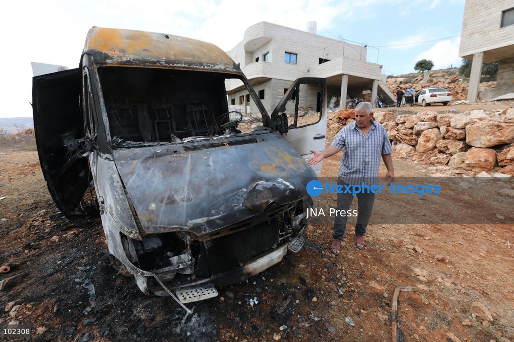 AQRABA, OCCUPIED WEST BANK, OCTOBER 6, 2026: Palestinians inspect vehicles damaged after Israeli settlers attacked the western part of Aqraba, south of Nablus, and set fire to four cars parked outside residents' homes early Tuesday. Aqraba Mayor Salah Jaber said the attackers also spray-painted slogans calling for revenge on property in the area. Photo by Nedal Shtieh / JNA Press. (Photo by Nedal Shtieh/JNA Press via Nexpher Images)