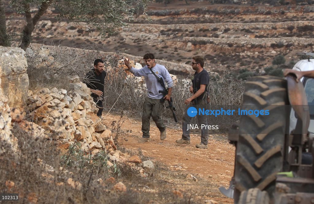 AQRABA, OCCUPIED WEST BANK, OCTOBER 6, 2026: Palestinian farmers come under attack by Israeli settlers while harvesting olives in the village of Aqraba, south of Nablus. Several Palestinians were wounded after settlers opened fire and assaulted farmers during the harvest, according to Palestinian reports. Israeli forces later detained a Palestinian farmer at the scene, according to information provided by the photographer. The Israeli military had not immediately commented on the reported shooting. Photo by Nedal Shtieh/ JNA Press. (Photo by Nedal Shtieh/JNA Press via Nexpher Images)
