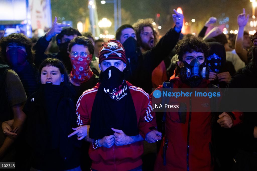 BARCELONA, SPAIN, OCTOBER 5, 2026: Demonstrators clash with riot police in central Barcelona following a mass protest over the city’s housing crisis. Groups threw objects at officers and set up burning barricades after the main demonstration ended, prompting Mossos d’Esquadra riot police to charge and disperse crowds around Passeig de Gracia, Placa de Catalunya and nearby streets. Around 20,000 people attended the earlier housing demonstration according to Barcelona police, while organizers estimated 120,000, calling for action over rising rents, evictions and housing affordability. Photo by Marc Asensio Clupés / JNA Press (Photo by Marc Asensio Clupes/JNA Press via Nexpher Images)