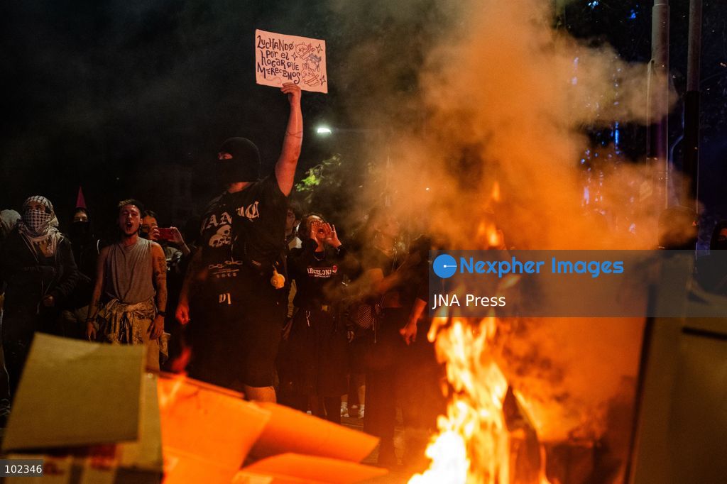 BARCELONA, SPAIN, OCTOBER 5, 2026: Demonstrators clash with riot police in central Barcelona following a mass protest over the city’s housing crisis. Groups threw objects at officers and set up burning barricades after the main demonstration ended, prompting Mossos d’Esquadra riot police to charge and disperse crowds around Passeig de Gracia, Placa de Catalunya and nearby streets. Around 20,000 people attended the earlier housing demonstration according to Barcelona police, while organizers estimated 120,000, calling for action over rising rents, evictions and housing affordability. Photo by Marc Asensio Clupés / JNA Press (Photo by Marc Asensio Clupes/JNA Press via Nexpher Images)
