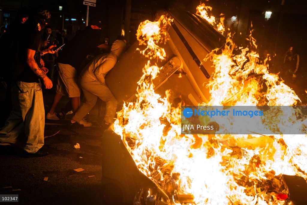 BARCELONA, SPAIN, OCTOBER 5, 2026: Demonstrators clash with riot police in central Barcelona following a mass protest over the city’s housing crisis. Groups threw objects at officers and set up burning barricades after the main demonstration ended, prompting Mossos d’Esquadra riot police to charge and disperse crowds around Passeig de Gracia, Placa de Catalunya and nearby streets. Around 20,000 people attended the earlier housing demonstration according to Barcelona police, while organizers estimated 120,000, calling for action over rising rents, evictions and housing affordability. Photo by Marc Asensio Clupés / JNA Press (Photo by Marc Asensio Clupes/JNA Press via Nexpher Images)
