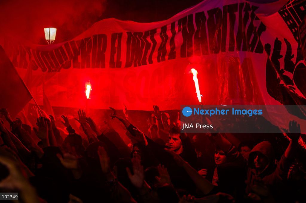 BARCELONA, SPAIN, OCTOBER 5, 2026: Demonstrators clash with riot police in central Barcelona following a mass protest over the city’s housing crisis. Groups threw objects at officers and set up burning barricades after the main demonstration ended, prompting Mossos d’Esquadra riot police to charge and disperse crowds around Passeig de Gracia, Placa de Catalunya and nearby streets. Around 20,000 people attended the earlier housing demonstration according to Barcelona police, while organizers estimated 120,000, calling for action over rising rents, evictions and housing affordability. Photo by Marc Asensio Clupés / JNA Press (Photo by Marc Asensio Clupes/JNA Press via Nexpher Images)