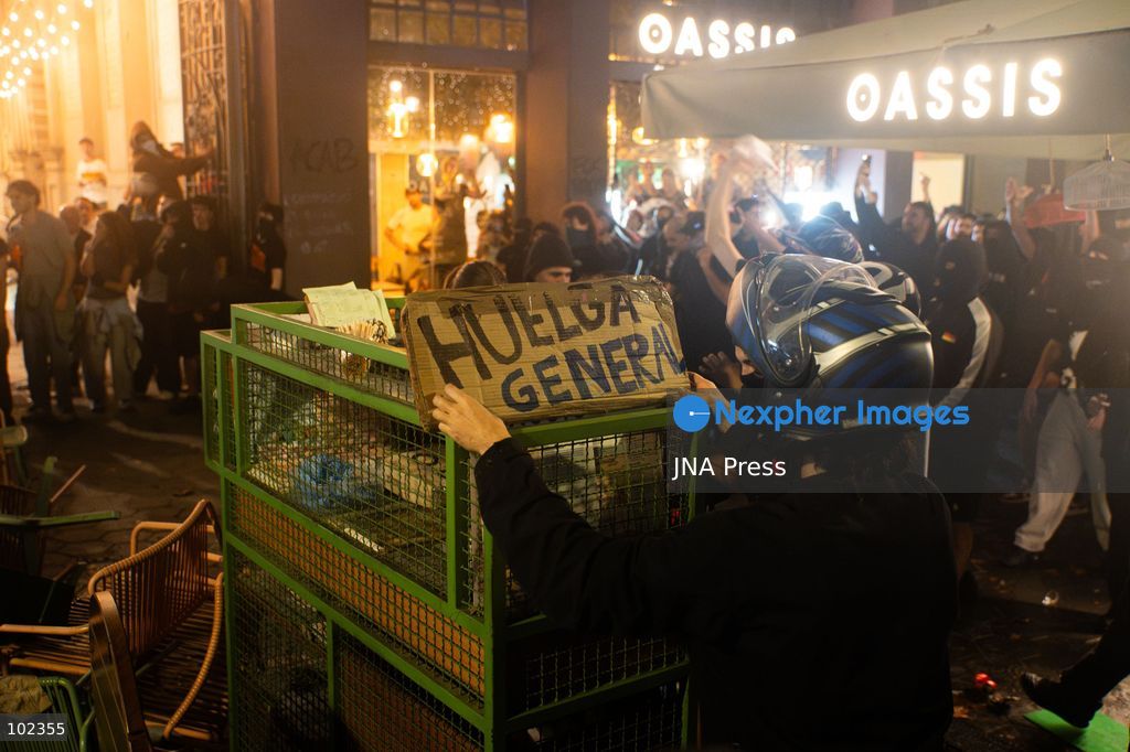 BARCELONA, SPAIN, OCTOBER 5, 2026: Demonstrators clash with riot police in central Barcelona following a mass protest over the city’s housing crisis. Groups threw objects at officers and set up burning barricades after the main demonstration ended, prompting Mossos d’Esquadra riot police to charge and disperse crowds around Passeig de Gracia, Placa de Catalunya and nearby streets. Around 20,000 people attended the earlier housing demonstration according to Barcelona police, while organizers estimated 120,000, calling for action over rising rents, evictions and housing affordability. Photo by Marc Asensio Clupés / JNA Press (Photo by Marc Asensio Clupes/JNA Press via Nexpher Images)
