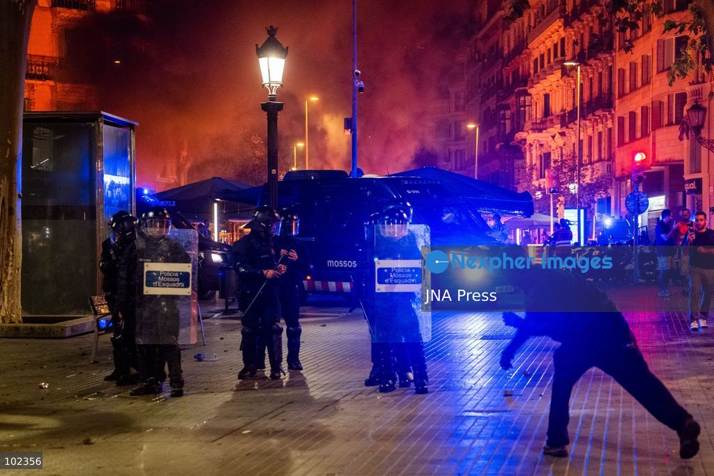 BARCELONA, SPAIN, OCTOBER 5, 2026: Demonstrators clash with riot police in central Barcelona following a mass protest over the city’s housing crisis. Groups threw objects at officers and set up burning barricades after the main demonstration ended, prompting Mossos d’Esquadra riot police to charge and disperse crowds around Passeig de Gracia, Placa de Catalunya and nearby streets. Around 20,000 people attended the earlier housing demonstration according to Barcelona police, while organizers estimated 120,000, calling for action over rising rents, evictions and housing affordability. Photo by Marc Asensio Clupés / JNA Press (Photo by Marc Asensio Clupes/JNA Press via Nexpher Images)