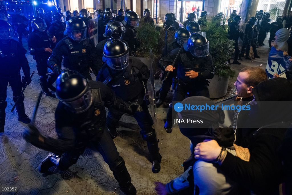 BARCELONA, SPAIN, OCTOBER 5, 2026: Demonstrators clash with riot police in central Barcelona following a mass protest over the city’s housing crisis. Groups threw objects at officers and set up burning barricades after the main demonstration ended, prompting Mossos d’Esquadra riot police to charge and disperse crowds around Passeig de Gracia, Placa de Catalunya and nearby streets. Around 20,000 people attended the earlier housing demonstration according to Barcelona police, while organizers estimated 120,000, calling for action over rising rents, evictions and housing affordability. Photo by Marc Asensio Clupés / JNA Press (Photo by Marc Asensio Clupes/JNA Press via Nexpher Images)