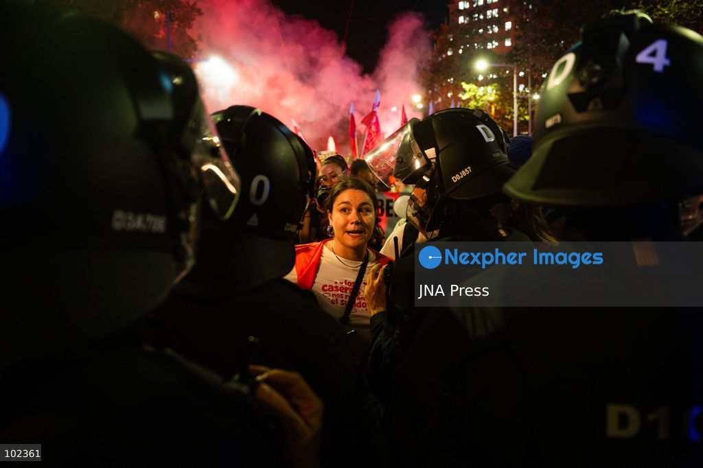 BARCELONA, SPAIN, OCTOBER 5, 2026: Demonstrators clash with riot police in central Barcelona following a mass protest over the city’s housing crisis. Groups threw objects at officers and set up burning barricades after the main demonstration ended, prompting Mossos d’Esquadra riot police to charge and disperse crowds around Passeig de Gracia, Placa de Catalunya and nearby streets. Around 20,000 people attended the earlier housing demonstration according to Barcelona police, while organizers estimated 120,000, calling for action over rising rents, evictions and housing affordability. Photo by Marc Asensio Clupés / JNA Press (Photo by Marc Asensio Clupes/JNA Press via Nexpher Images)