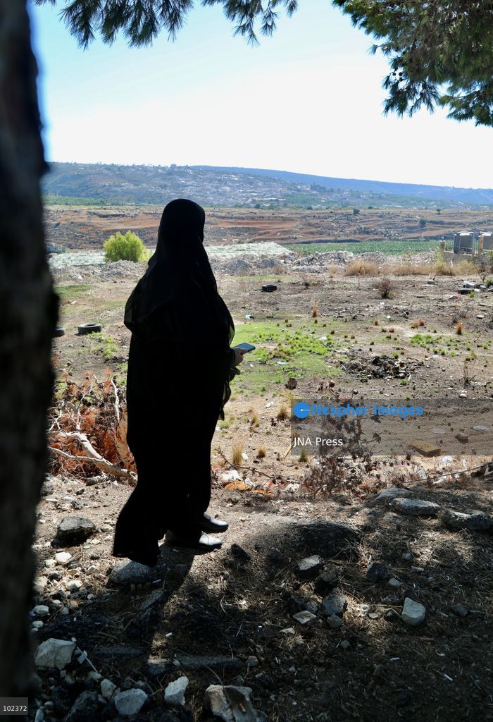 HANNIYEH, SOUTH LEBANON, OCTOBER 6, 2026: Displaced residents of Mansouri watch from the nearby village of Hanniyeh as an Israeli strike hits their home village in southern Lebanon. Residents gather at the vantage point as Israeli attacks and demolitions continue in Mansouri, using mobile phone cameras and zoom lenses to try to identify which homes or buildings have been hit. Mansouri residents have been displaced from the village amid continuing Israeli military operations in the area. Photo by Amanda Flybjerg / JNA PRES (Photo by Amanda Flyvbjerg/JNA Press via Nexpher Images)