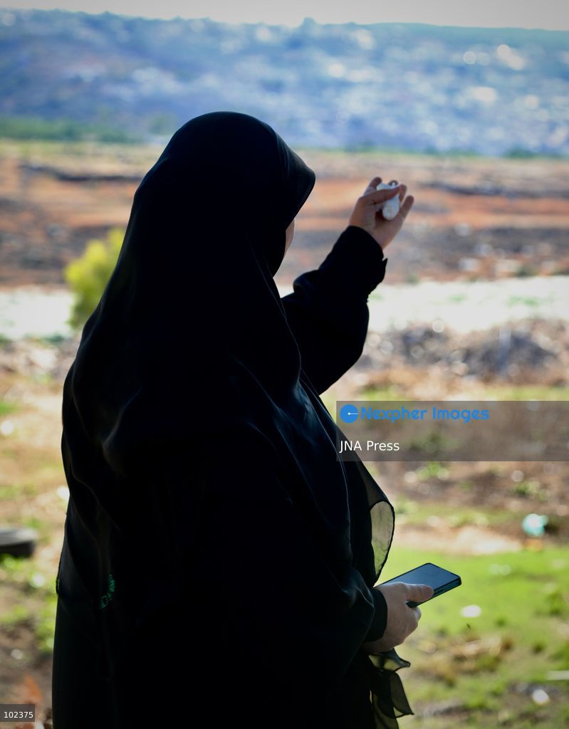 HANNIYEH, SOUTH LEBANON, OCTOBER 6, 2026: Displaced residents of Mansouri watch from the nearby village of Hanniyeh as an Israeli strike hits their home village in southern Lebanon. Residents gather at the vantage point as Israeli attacks and demolitions continue in Mansouri, using mobile phone cameras and zoom lenses to try to identify which homes or buildings have been hit. Mansouri residents have been displaced from the village amid continuing Israeli military operations in the area. Photo by Amanda Flybjerg / JNA PRES (Photo by Amanda Flyvbjerg/JNA Press via Nexpher Images)