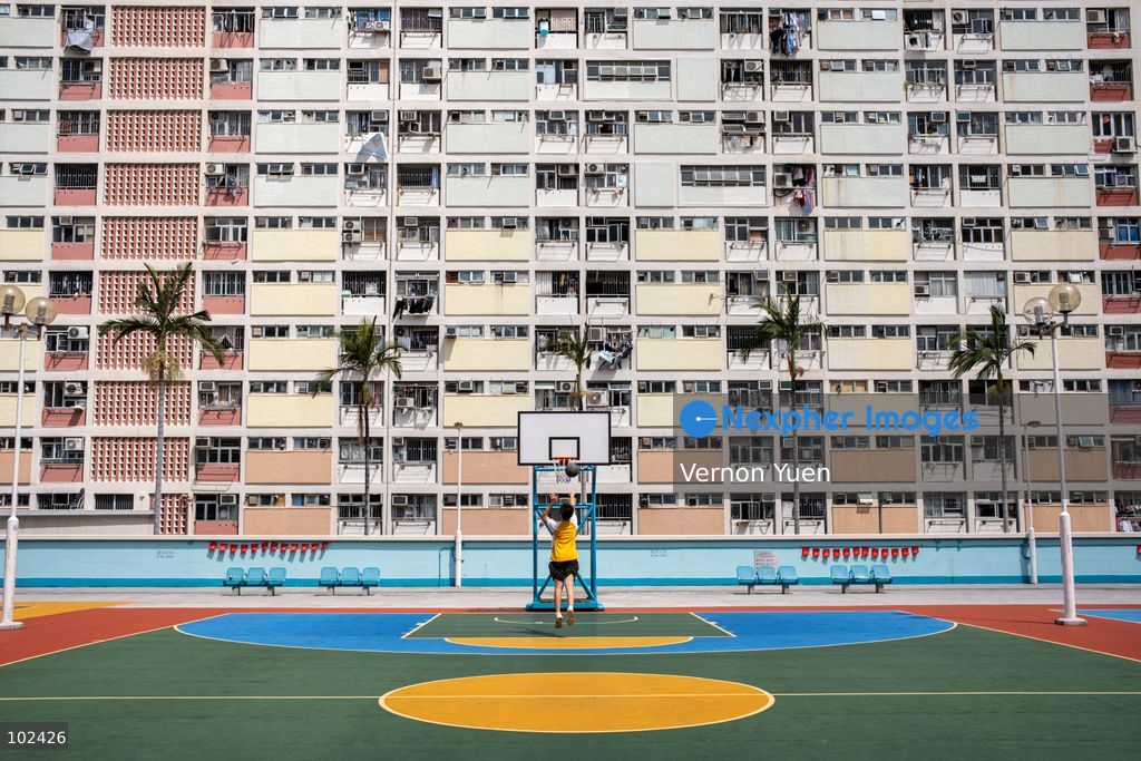 A boy playing basketball at Choi Hung Estate on October 7, 2026 in Hong Kong. (Photo by Vernon Yuen/Nexpher Images)
