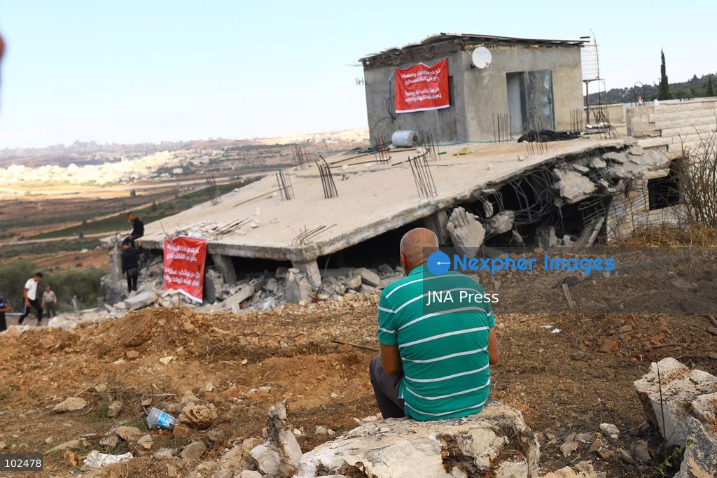 BIDDU, OCCUPIED WEST BANK, OCTOBER 7, 2026: Israeli forces accompanied by military bulldozers and engineering units demolish the home of Palestinian prisoner Qadri Samara in Biddu, northwest of Jerusalem. Israeli forces evacuated the house and surrounding homes before demolishing parts of the building and destroying it with controlled explosions. Israeli authorities accuse Samara of carrying out a shooting attack near the Israeli settlement of Neve Tzuf, also known as Halamish, in which an Israeli was killed. The demolition took place during a wider Israeli military operation involving raids, arrests and movement restrictions in several Palestinian towns and villages northwest of Jerusalem. Photo by Salman Mohsen Alkhatib / JNA Press. (Photo by Salman Mohsen Alkhatib/JNA Press via Nexpher Images)