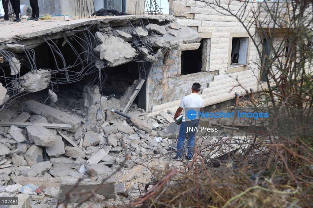 BIDDU, OCCUPIED WEST BANK, OCTOBER 7, 2026: Israeli forces accompanied by military bulldozers and engineering units demolish the home of Palestinian prisoner Qadri Samara in Biddu, northwest of Jerusalem. Israeli forces evacuated the house and surrounding homes before demolishing parts of the building and destroying it with controlled explosions. Israeli authorities accuse Samara of carrying out a shooting attack near the Israeli settlement of Neve Tzuf, also known as Halamish, in which an Israeli was killed. The demolition took place during a wider Israeli military operation involving raids, arrests and movement restrictions in several Palestinian towns and villages northwest of Jerusalem. Photo by Salman Mohsen Alkhatib / JNA Press. (Photo by Salman Mohsen Alkhatib/JNA Press via Nexpher Images)