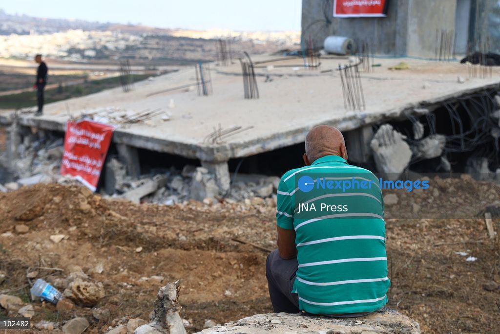 BIDDU, OCCUPIED WEST BANK, OCTOBER 7, 2026: Israeli forces accompanied by military bulldozers and engineering units demolish the home of Palestinian prisoner Qadri Samara in Biddu, northwest of Jerusalem. Israeli forces evacuated the house and surrounding homes before demolishing parts of the building and destroying it with controlled explosions. Israeli authorities accuse Samara of carrying out a shooting attack near the Israeli settlement of Neve Tzuf, also known as Halamish, in which an Israeli was killed. The demolition took place during a wider Israeli military operation involving raids, arrests and movement restrictions in several Palestinian towns and villages northwest of Jerusalem. Photo by Salman Mohsen Alkhatib / JNA Press. (Photo by Salman Mohsen Alkhatib/JNA Press via Nexpher Images)