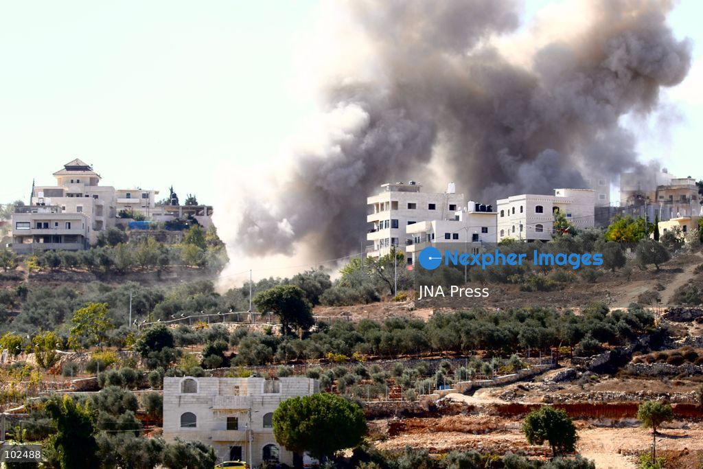 BIDDU, OCCUPIED WEST BANK, OCTOBER 7, 2026: Israeli forces accompanied by military bulldozers and engineering units demolish the home of Palestinian prisoner Qadri Samara in Biddu, northwest of Jerusalem. Israeli forces evacuated the house and surrounding homes before demolishing parts of the building and destroying it with controlled explosions. Israeli authorities accuse Samara of carrying out a shooting attack near the Israeli settlement of Neve Tzuf, also known as Halamish, in which an Israeli was killed. The demolition took place during a wider Israeli military operation involving raids, arrests and movement restrictions in several Palestinian towns and villages northwest of Jerusalem. Photo by Salman Mohsen Alkhatib / JNA Press. (Photo by Salman Mohsen Alkhatib/JNA Press via Nexpher Images)