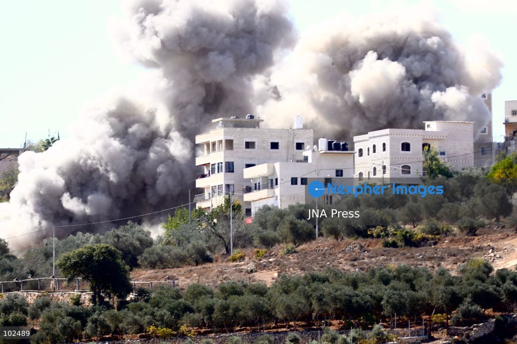 BIDDU, OCCUPIED WEST BANK, OCTOBER 7, 2026: Israeli forces accompanied by military bulldozers and engineering units demolish the home of Palestinian prisoner Qadri Samara in Biddu, northwest of Jerusalem. Israeli forces evacuated the house and surrounding homes before demolishing parts of the building and destroying it with controlled explosions. Israeli authorities accuse Samara of carrying out a shooting attack near the Israeli settlement of Neve Tzuf, also known as Halamish, in which an Israeli was killed. The demolition took place during a wider Israeli military operation involving raids, arrests and movement restrictions in several Palestinian towns and villages northwest of Jerusalem. Photo by Salman Mohsen Alkhatib / JNA Press. (Photo by Salman Mohsen Alkhatib/JNA Press via Nexpher Images)