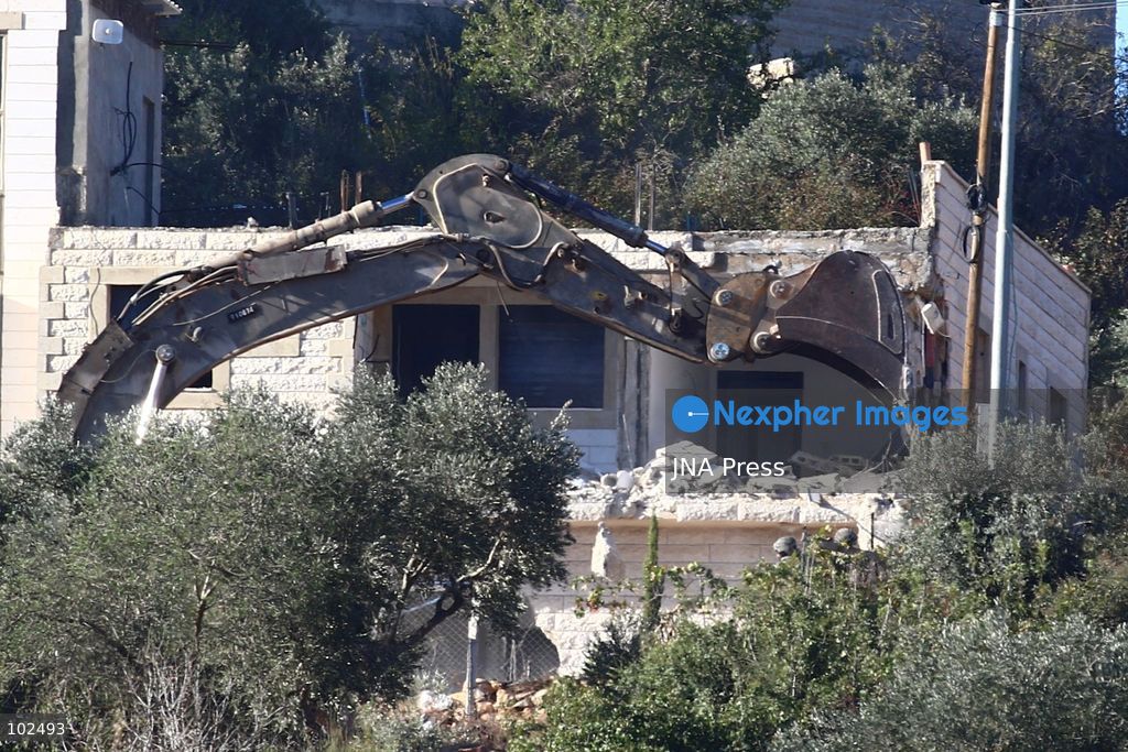 BIDDU, OCCUPIED WEST BANK, OCTOBER 7, 2026: Israeli forces accompanied by military bulldozers and engineering units demolish the home of Palestinian prisoner Qadri Samara in Biddu, northwest of Jerusalem. Israeli forces evacuated the house and surrounding homes before demolishing parts of the building and destroying it with controlled explosions. Israeli authorities accuse Samara of carrying out a shooting attack near the Israeli settlement of Neve Tzuf, also known as Halamish, in which an Israeli was killed. The demolition took place during a wider Israeli military operation involving raids, arrests and movement restrictions in several Palestinian towns and villages northwest of Jerusalem. Photo by Salman Mohsen Alkhatib / JNA Press. (Photo by Salman Mohsen Alkhatib/JNA Press via Nexpher Images)