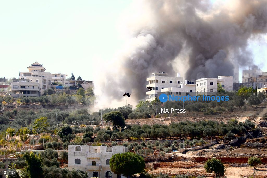 BIDDU, OCCUPIED WEST BANK, OCTOBER 7, 2026: Israeli forces accompanied by military bulldozers and engineering units demolish the home of Palestinian prisoner Qadri Samara in Biddu, northwest of Jerusalem. Israeli forces evacuated the house and surrounding homes before demolishing parts of the building and destroying it with controlled explosions. Israeli authorities accuse Samara of carrying out a shooting attack near the Israeli settlement of Neve Tzuf, also known as Halamish, in which an Israeli was killed. The demolition took place during a wider Israeli military operation involving raids, arrests and movement restrictions in several Palestinian towns and villages northwest of Jerusalem. Photo by Salman Mohsen Alkhatib / JNA Press. (Photo by Salman Mohsen Alkhatib/JNA Press via Nexpher Images)