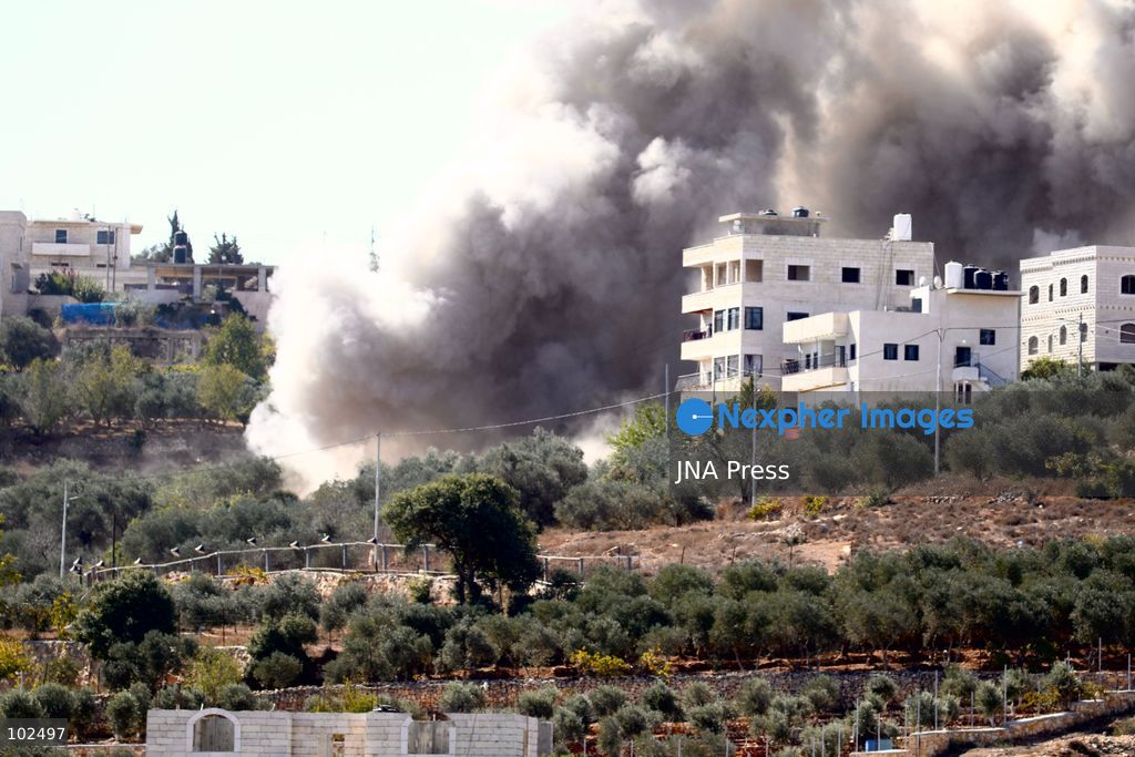BIDDU, OCCUPIED WEST BANK, OCTOBER 7, 2026: Israeli forces accompanied by military bulldozers and engineering units demolish the home of Palestinian prisoner Qadri Samara in Biddu, northwest of Jerusalem. Israeli forces evacuated the house and surrounding homes before demolishing parts of the building and destroying it with controlled explosions. Israeli authorities accuse Samara of carrying out a shooting attack near the Israeli settlement of Neve Tzuf, also known as Halamish, in which an Israeli was killed. The demolition took place during a wider Israeli military operation involving raids, arrests and movement restrictions in several Palestinian towns and villages northwest of Jerusalem. Photo by Salman Mohsen Alkhatib / JNA Press. (Photo by Salman Mohsen Alkhatib/JNA Press via Nexpher Images)