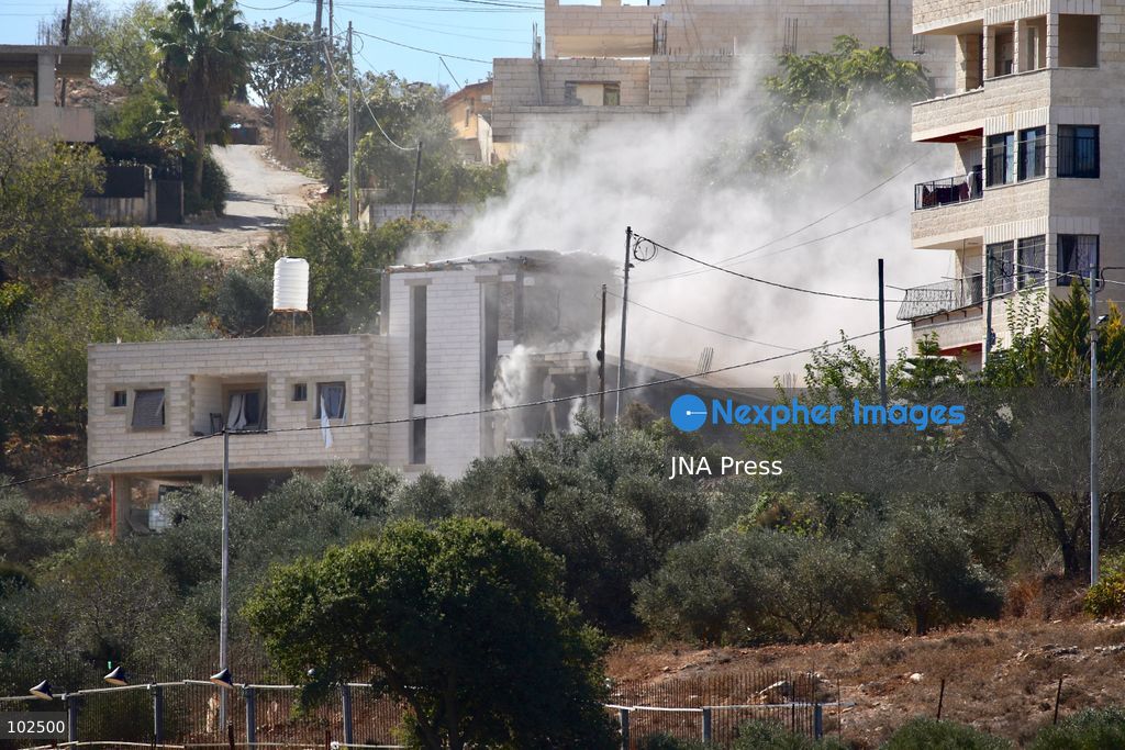 BIDDU, OCCUPIED WEST BANK, OCTOBER 7, 2026: Israeli forces accompanied by military bulldozers and engineering units demolish the home of Palestinian prisoner Qadri Samara in Biddu, northwest of Jerusalem. Israeli forces evacuated the house and surrounding homes before demolishing parts of the building and destroying it with controlled explosions. Israeli authorities accuse Samara of carrying out a shooting attack near the Israeli settlement of Neve Tzuf, also known as Halamish, in which an Israeli was killed. The demolition took place during a wider Israeli military operation involving raids, arrests and movement restrictions in several Palestinian towns and villages northwest of Jerusalem. Photo by Salman Mohsen Alkhatib / JNA Press. (Photo by Salman Mohsen Alkhatib/JNA Press via Nexpher Images)