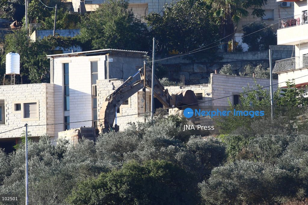 BIDDU, OCCUPIED WEST BANK, OCTOBER 7, 2026: Israeli forces accompanied by military bulldozers and engineering units demolish the home of Palestinian prisoner Qadri Samara in Biddu, northwest of Jerusalem. Israeli forces evacuated the house and surrounding homes before demolishing parts of the building and destroying it with controlled explosions. Israeli authorities accuse Samara of carrying out a shooting attack near the Israeli settlement of Neve Tzuf, also known as Halamish, in which an Israeli was killed. The demolition took place during a wider Israeli military operation involving raids, arrests and movement restrictions in several Palestinian towns and villages northwest of Jerusalem. Photo by Salman Mohsen Alkhatib / JNA Press. (Photo by Salman Mohsen Alkhatib/JNA Press via Nexpher Images)