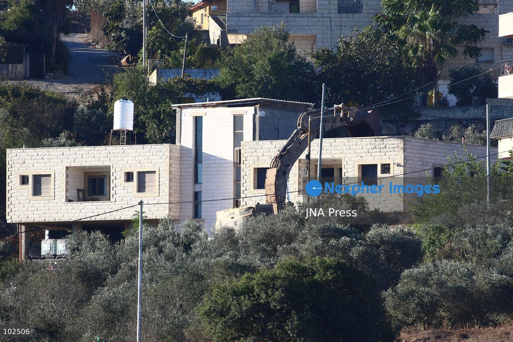 BIDDU, OCCUPIED WEST BANK, OCTOBER 7, 2026: Israeli forces accompanied by military bulldozers and engineering units demolish the home of Palestinian prisoner Qadri Samara in Biddu, northwest of Jerusalem. Israeli forces evacuated the house and surrounding homes before demolishing parts of the building and destroying it with controlled explosions. Israeli authorities accuse Samara of carrying out a shooting attack near the Israeli settlement of Neve Tzuf, also known as Halamish, in which an Israeli was killed. The demolition took place during a wider Israeli military operation involving raids, arrests and movement restrictions in several Palestinian towns and villages northwest of Jerusalem. Photo by Salman Mohsen Alkhatib / JNA Press. (Photo by Salman Mohsen Alkhatib/JNA Press via Nexpher Images)
