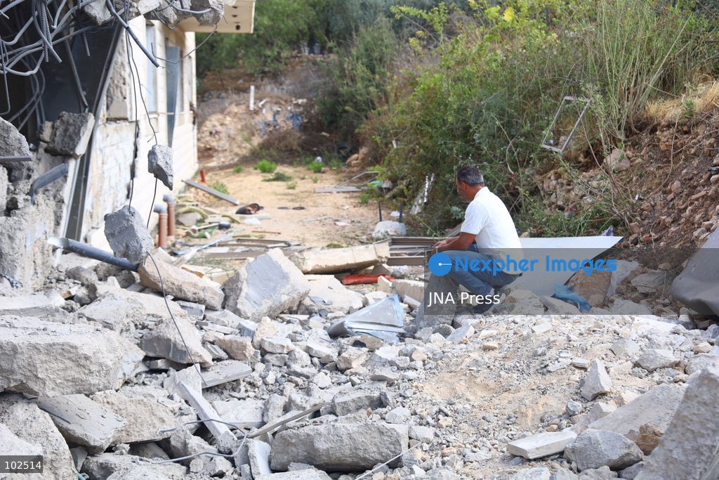 BIDDU, OCCUPIED WEST BANK, OCTOBER 7, 2026: Israeli forces accompanied by military bulldozers and engineering units demolish the home of Palestinian prisoner Qadri Samara in Biddu, northwest of Jerusalem. Israeli forces evacuated the house and surrounding homes before demolishing parts of the building and destroying it with controlled explosions. Israeli authorities accuse Samara of carrying out a shooting attack near the Israeli settlement of Neve Tzuf, also known as Halamish, in which an Israeli was killed. The demolition took place during a wider Israeli military operation involving raids, arrests and movement restrictions in several Palestinian towns and villages northwest of Jerusalem. Photo by Salman Mohsen Alkhatib / JNA Press. (Photo by Salman Mohsen Alkhatib/JNA Press via Nexpher Images)