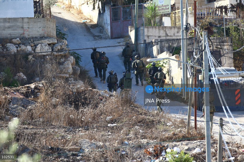 QATANNA, OCCUPIED WEST BANK, OCTOBER 7, 2026: Israeli forces carry out a military operation in the town of Qatanna, northwest of Jerusalem, raiding residential homes, detaining Palestinian residents and conducting field interrogations. Israeli forces also imposed a closure on the town, restricting movement in and out of the area. The operation in Qatanna formed part of a wider campaign across towns and villages northwest of Jerusalem, during which around 50 Palestinians were detained or arrested and dozens of homes were raided, according to Palestinian officials. Photo by Salman Mohsen Alkhatib / JNA Press. (Photo by Salman Mohsen Alkhatib/JNA Press via Nexpher Images)