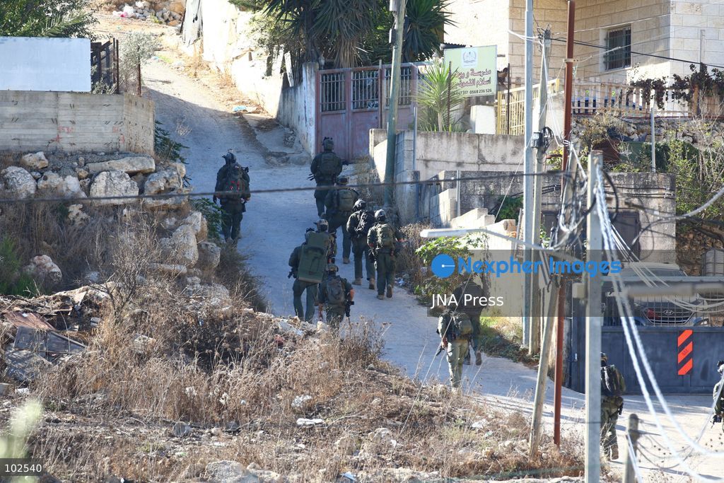 QATANNA, OCCUPIED WEST BANK, OCTOBER 7, 2026: Israeli forces carry out a military operation in the town of Qatanna, northwest of Jerusalem, raiding residential homes, detaining Palestinian residents and conducting field interrogations. Israeli forces also imposed a closure on the town, restricting movement in and out of the area. The operation in Qatanna formed part of a wider campaign across towns and villages northwest of Jerusalem, during which around 50 Palestinians were detained or arrested and dozens of homes were raided, according to Palestinian officials. Photo by Salman Mohsen Alkhatib / JNA Press. (Photo by Salman Mohsen Alkhatib/JNA Press via Nexpher Images)