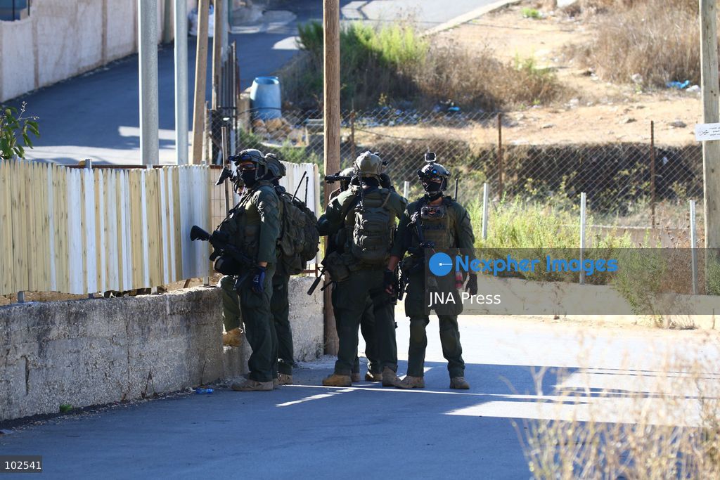 QATANNA, OCCUPIED WEST BANK, OCTOBER 7, 2026: Israeli forces carry out a military operation in the town of Qatanna, northwest of Jerusalem, raiding residential homes, detaining Palestinian residents and conducting field interrogations. Israeli forces also imposed a closure on the town, restricting movement in and out of the area. The operation in Qatanna formed part of a wider campaign across towns and villages northwest of Jerusalem, during which around 50 Palestinians were detained or arrested and dozens of homes were raided, according to Palestinian officials. Photo by Salman Mohsen Alkhatib / JNA Press. (Photo by Salman Mohsen Alkhatib/JNA Press via Nexpher Images)
