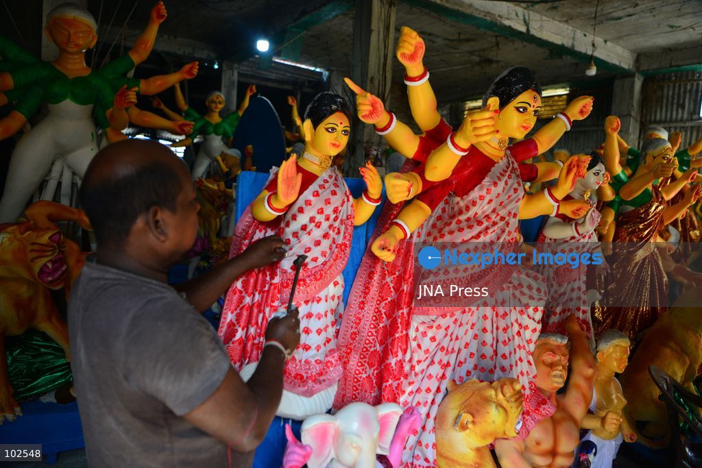 SILIGURI, INDIA, OCTOBER 7, 2026: An artisan adds finishing touches to clay idols of the Hindu goddess Durga and other deities at a workshop in Siliguri ahead of the Durga Puja festival. Artisans prepare and decorate the religious figures as communities make preparations for the annual Hindu festival dedicated to the worship of Durga. Photo by DIPTENDU DUTTA / JNA Press. (Photo by DIPTENDU DUTTA/JNA Press via Nexpher Images)