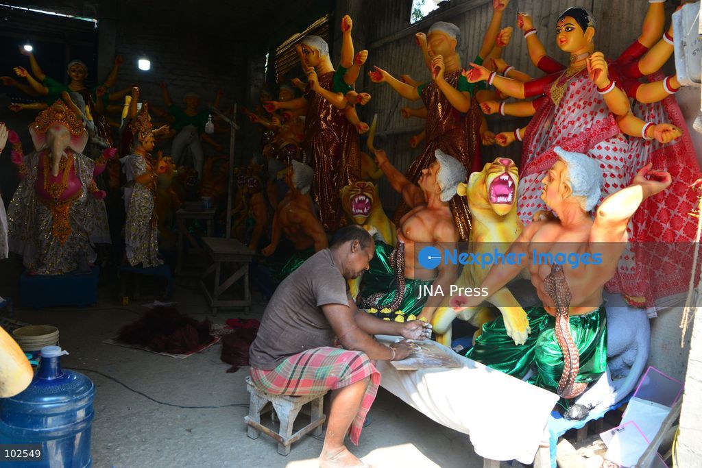 SILIGURI, INDIA, OCTOBER 7, 2026: An artisan adds finishing touches to clay idols of the Hindu goddess Durga and other deities at a workshop in Siliguri ahead of the Durga Puja festival. Artisans prepare and decorate the religious figures as communities make preparations for the annual Hindu festival dedicated to the worship of Durga. Photo by DIPTENDU DUTTA / JNA Press. (Photo by DIPTENDU DUTTA/JNA Press via Nexpher Images)
