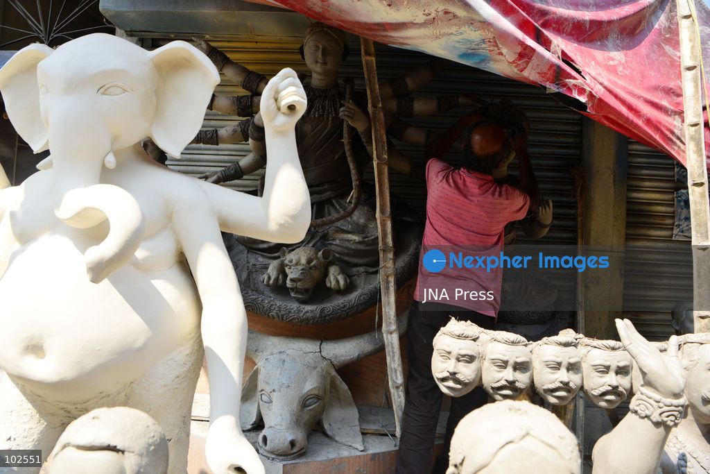 SILIGURI, INDIA, OCTOBER 7, 2026: An artisan adds finishing touches to clay idols of the Hindu goddess Durga and other deities at a workshop in Siliguri ahead of the Durga Puja festival. Artisans prepare and decorate the religious figures as communities make preparations for the annual Hindu festival dedicated to the worship of Durga. Photo by DIPTENDU DUTTA / JNA Press. (Photo by DIPTENDU DUTTA/JNA Press via Nexpher Images)