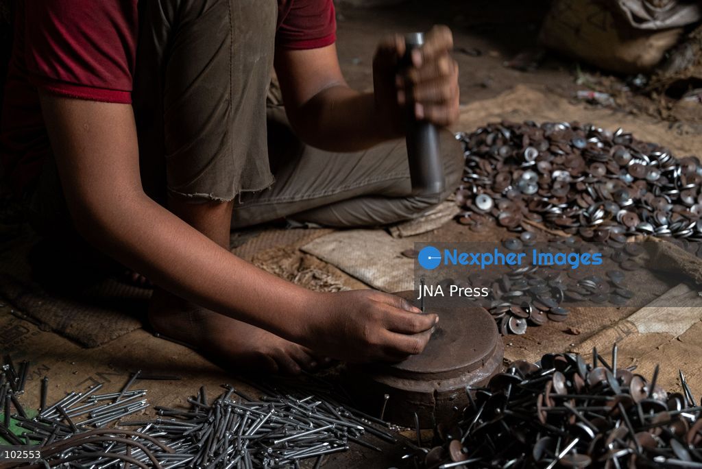 KERANIGANJ, DHAKA, BANGLADESH, OCTOBER 7, 2026: Young workers carry out manual tasks inside aluminum factories in the Zinjira industrial area of Keraniganj, near Dhaka. Sanaullah, believed to be around nine or 10 years old, says he works from 8 a.m. until 7 p.m. and earns about 1,400 Bangladeshi taka ($11) a month. Children are seen grinding and handling metal products inside workshops where workers are exposed to heat, smoke, metal dust, machinery and sharp equipment, with limited protective gear visible. The long working hours also leave little time for regular schooling. Photo by Bipul Ahmed / JNA Press. (Photo by Bipul Ahmed/JNA Press via Nexpher Images)