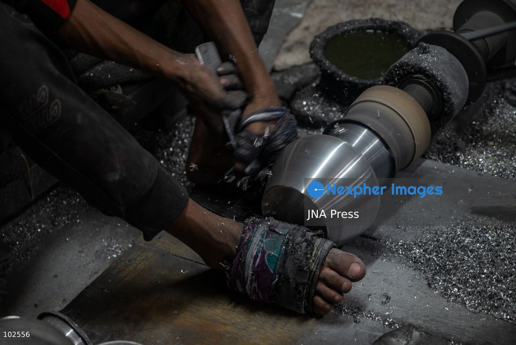 KERANIGANJ, DHAKA, BANGLADESH, OCTOBER 7, 2026: Young workers carry out manual tasks inside aluminum factories in the Zinjira industrial area of Keraniganj, near Dhaka. Sanaullah, believed to be around nine or 10 years old, says he works from 8 a.m. until 7 p.m. and earns about 1,400 Bangladeshi taka ($11) a month. Children are seen grinding and handling metal products inside workshops where workers are exposed to heat, smoke, metal dust, machinery and sharp equipment, with limited protective gear visible. The long working hours also leave little time for regular schooling. Photo by Bipul Ahmed / JNA Press. (Photo by Bipul Ahmed/JNA Press via Nexpher Images)