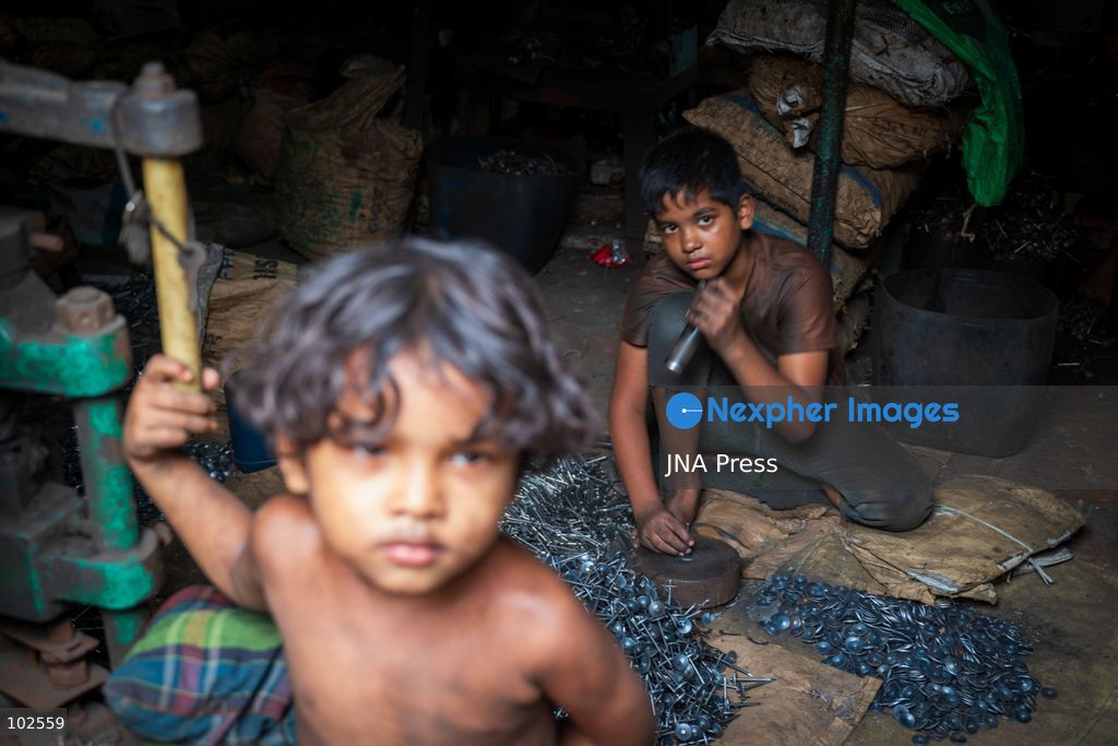 KERANIGANJ, DHAKA, BANGLADESH, OCTOBER 7, 2026: Young workers carry out manual tasks inside aluminum factories in the Zinjira industrial area of Keraniganj, near Dhaka. Sanaullah, believed to be around nine or 10 years old, says he works from 8 a.m. until 7 p.m. and earns about 1,400 Bangladeshi taka ($11) a month. Children are seen grinding and handling metal products inside workshops where workers are exposed to heat, smoke, metal dust, machinery and sharp equipment, with limited protective gear visible. The long working hours also leave little time for regular schooling. Photo by Bipul Ahmed / JNA Press. (Photo by Bipul Ahmed/JNA Press via Nexpher Images)