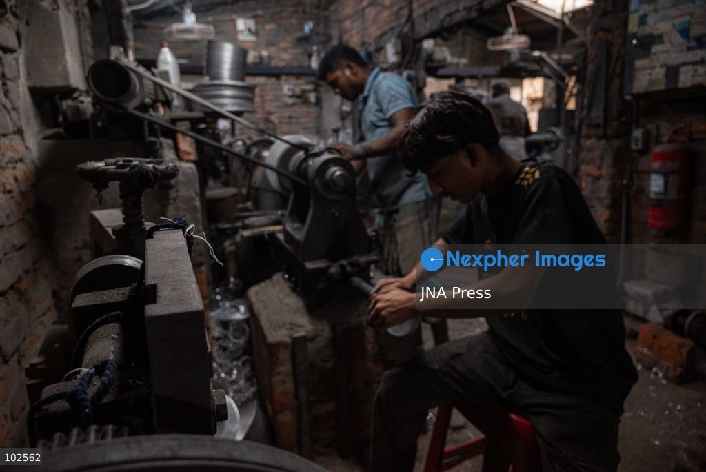 KERANIGANJ, DHAKA, BANGLADESH, OCTOBER 7, 2026: Young workers carry out manual tasks inside aluminum factories in the Zinjira industrial area of Keraniganj, near Dhaka. Sanaullah, believed to be around nine or 10 years old, says he works from 8 a.m. until 7 p.m. and earns about 1,400 Bangladeshi taka ($11) a month. Children are seen grinding and handling metal products inside workshops where workers are exposed to heat, smoke, metal dust, machinery and sharp equipment, with limited protective gear visible. The long working hours also leave little time for regular schooling. Photo by Bipul Ahmed / JNA Press. (Photo by Bipul Ahmed/JNA Press via Nexpher Images)