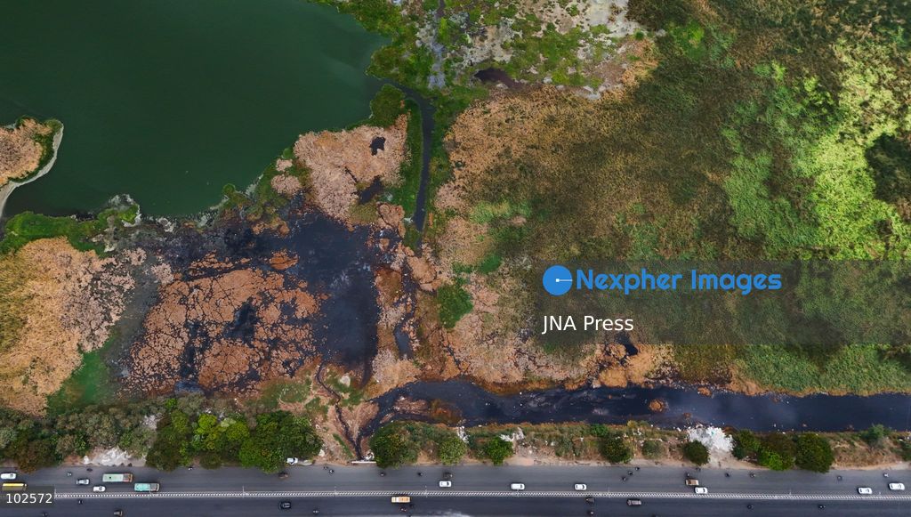 CHENNAI, INDIA, OCTOBER 7, 2026: Dark brown discolored water is seen near a landfill at the Pallikaranai marshland in Chennai in an aerial view. Local residents have raised concerns over pollution in the wetland and reported foul odours from the area, calling on authorities to investigate the source of the discoloration and take action to protect the marshland. Pallikaranai is an important urban wetland and habitat for a wide range of wildlife. Photo by Lucas M / JNA Press. (Photo by Lucas M/JNA Press via Nexpher Images)