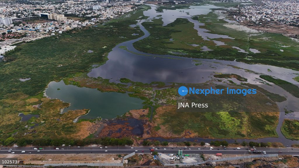 CHENNAI, INDIA, OCTOBER 7, 2026: Dark brown discolored water is seen near a landfill at the Pallikaranai marshland in Chennai in an aerial view. Local residents have raised concerns over pollution in the wetland and reported foul odours from the area, calling on authorities to investigate the source of the discoloration and take action to protect the marshland. Pallikaranai is an important urban wetland and habitat for a wide range of wildlife. Photo by Lucas M / JNA Press. (Photo by Lucas M/JNA Press via Nexpher Images)