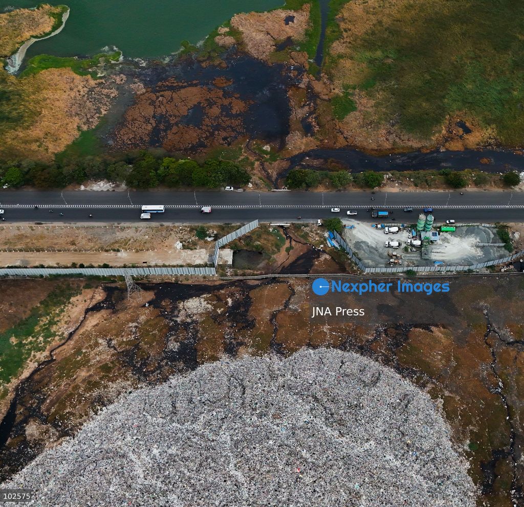CHENNAI, INDIA, OCTOBER 7, 2026: Dark brown discolored water is seen near a landfill at the Pallikaranai marshland in Chennai in an aerial view. Local residents have raised concerns over pollution in the wetland and reported foul odours from the area, calling on authorities to investigate the source of the discoloration and take action to protect the marshland. Pallikaranai is an important urban wetland and habitat for a wide range of wildlife. Photo by Lucas M / JNA Press. (Photo by Lucas M/JNA Press via Nexpher Images)