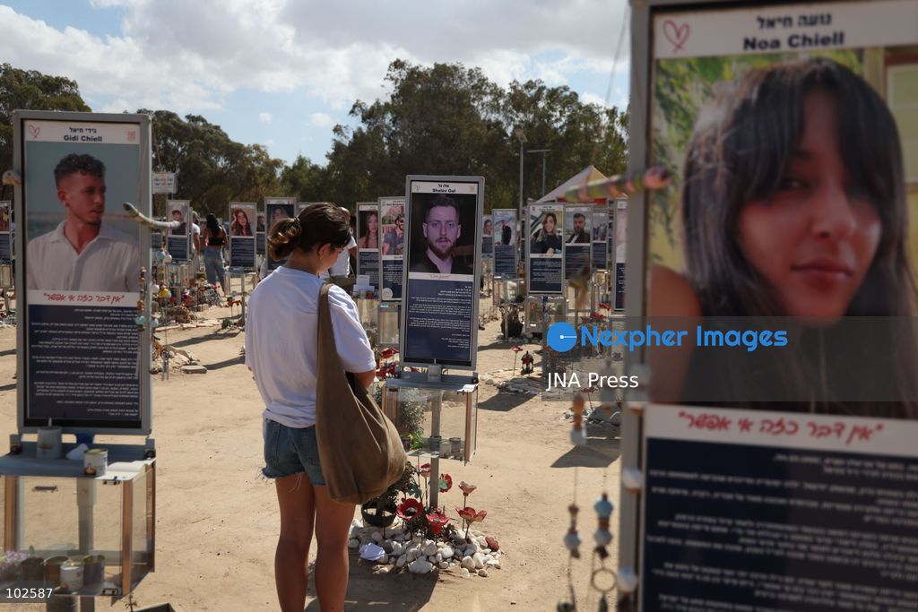 RE’IM, ISRAEL, OCTOBER 7, 2026: Israelis visit the Nova music festival memorial site near Re’im to mark the third anniversary of the October 7, 2023 attack. Visitors walk among memorials bearing the photographs and names of people killed at the festival site, where hundreds were killed during the Hamas-led attack three years earlier. Families, friends and members of the public gathered at the site to remember the victims and pay tribute to those killed. Photo by Saeed Qaq / JNA Press. (Photo by Saeed Qaq/JNA Press via Nexpher Images)