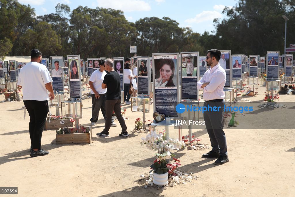 RE’IM, ISRAEL, OCTOBER 7, 2026: Israelis visit the Nova music festival memorial site near Re’im to mark the third anniversary of the October 7, 2023 attack. Visitors walk among memorials bearing the photographs and names of people killed at the festival site, where hundreds were killed during the Hamas-led attack three years earlier. Families, friends and members of the public gathered at the site to remember the victims and pay tribute to those killed. Photo by Saeed Qaq / JNA Press. (Photo by Saeed Qaq/JNA Press via Nexpher Images)