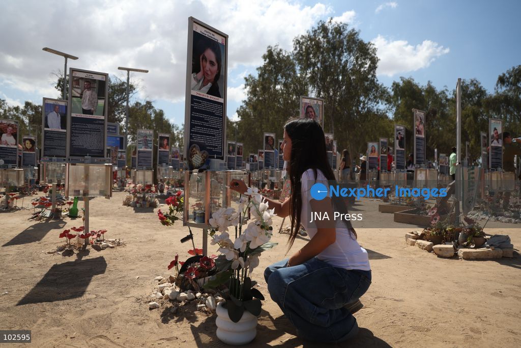RE’IM, ISRAEL, OCTOBER 7, 2026: Israelis visit the Nova music festival memorial site near Re’im to mark the third anniversary of the October 7, 2023 attack. Visitors walk among memorials bearing the photographs and names of people killed at the festival site, where hundreds were killed during the Hamas-led attack three years earlier. Families, friends and members of the public gathered at the site to remember the victims and pay tribute to those killed. Photo by Saeed Qaq / JNA Press. (Photo by Saeed Qaq/JNA Press via Nexpher Images)