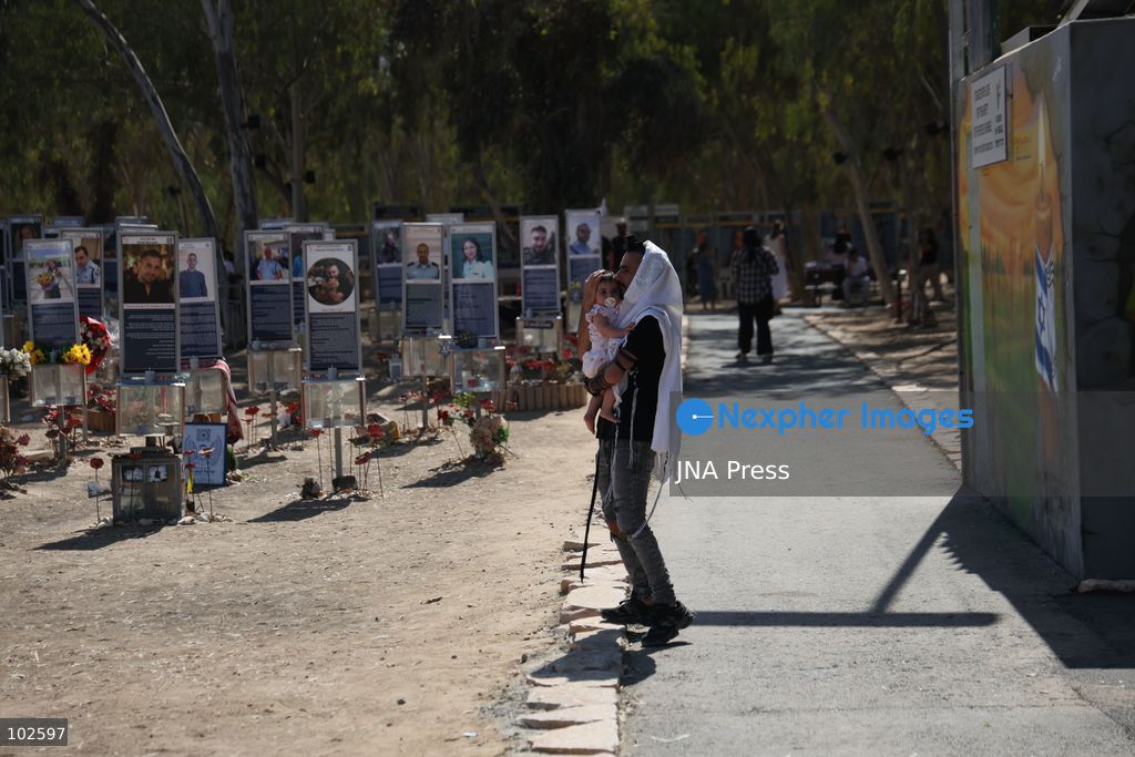 RE’IM, ISRAEL, OCTOBER 7, 2026: Israelis visit the Nova music festival memorial site near Re’im to mark the third anniversary of the October 7, 2023 attack. Visitors walk among memorials bearing the photographs and names of people killed at the festival site, where hundreds were killed during the Hamas-led attack three years earlier. Families, friends and members of the public gathered at the site to remember the victims and pay tribute to those killed. Photo by Saeed Qaq / JNA Press. (Photo by Saeed Qaq/JNA Press via Nexpher Images)