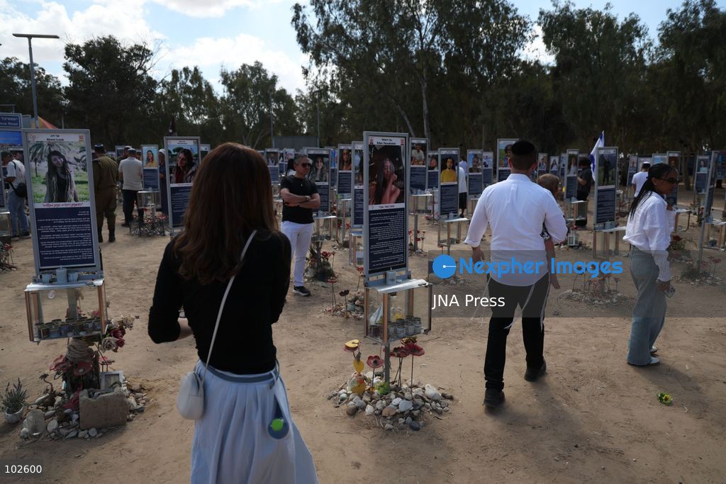 RE’IM, ISRAEL, OCTOBER 7, 2026: Israelis visit the Nova music festival memorial site near Re’im to mark the third anniversary of the October 7, 2023 attack. Visitors walk among memorials bearing the photographs and names of people killed at the festival site, where hundreds were killed during the Hamas-led attack three years earlier. Families, friends and members of the public gathered at the site to remember the victims and pay tribute to those killed. Photo by Saeed Qaq / JNA Press. (Photo by Saeed Qaq/JNA Press via Nexpher Images)