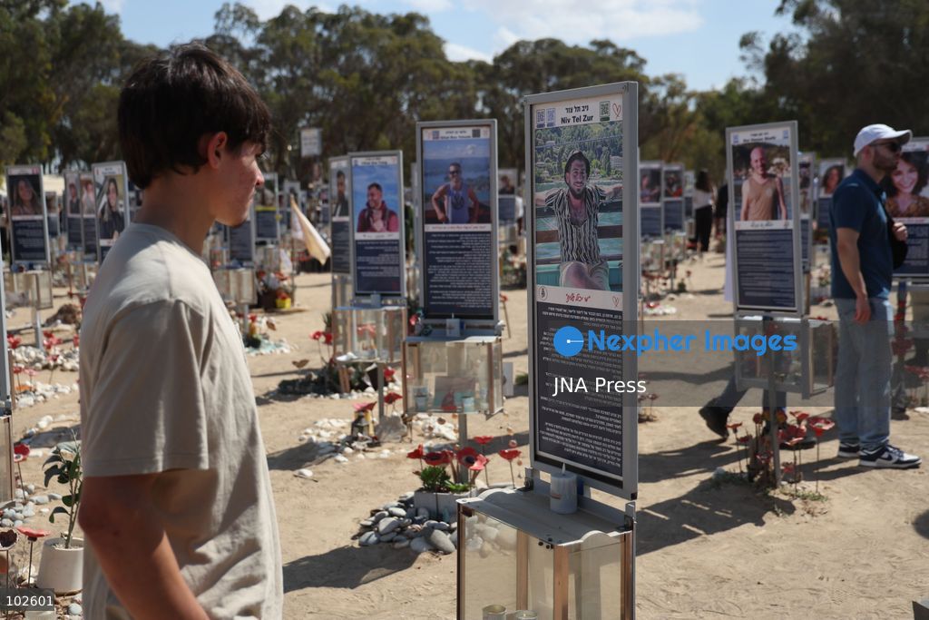 RE’IM, ISRAEL, OCTOBER 7, 2026: Israelis visit the Nova music festival memorial site near Re’im to mark the third anniversary of the October 7, 2023 attack. Visitors walk among memorials bearing the photographs and names of people killed at the festival site, where hundreds were killed during the Hamas-led attack three years earlier. Families, friends and members of the public gathered at the site to remember the victims and pay tribute to those killed. Photo by Saeed Qaq / JNA Press. (Photo by Saeed Qaq/JNA Press via Nexpher Images)