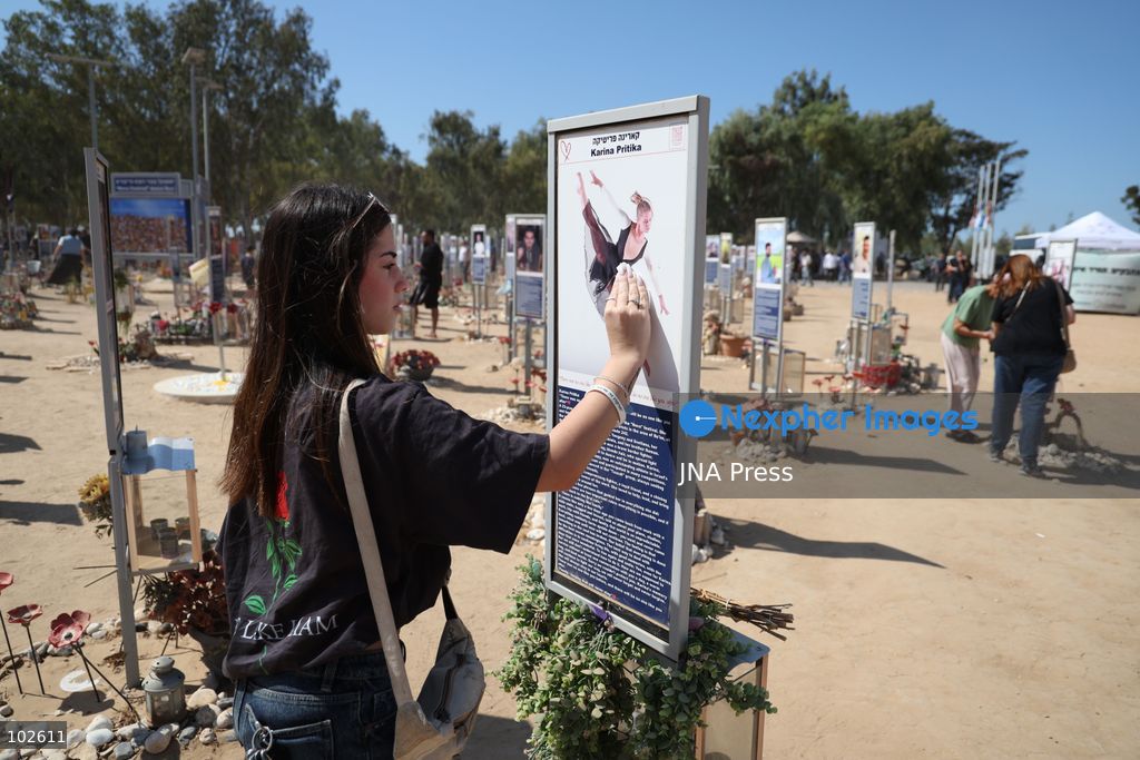 RE’IM, ISRAEL, OCTOBER 7, 2026: Israelis visit the Nova music festival memorial site near Re’im to mark the third anniversary of the October 7, 2023 attack. Visitors walk among memorials bearing the photographs and names of people killed at the festival site, where hundreds were killed during the Hamas-led attack three years earlier. Families, friends and members of the public gathered at the site to remember the victims and pay tribute to those killed. Photo by Saeed Qaq / JNA Press. (Photo by Saeed Qaq/JNA Press via Nexpher Images)